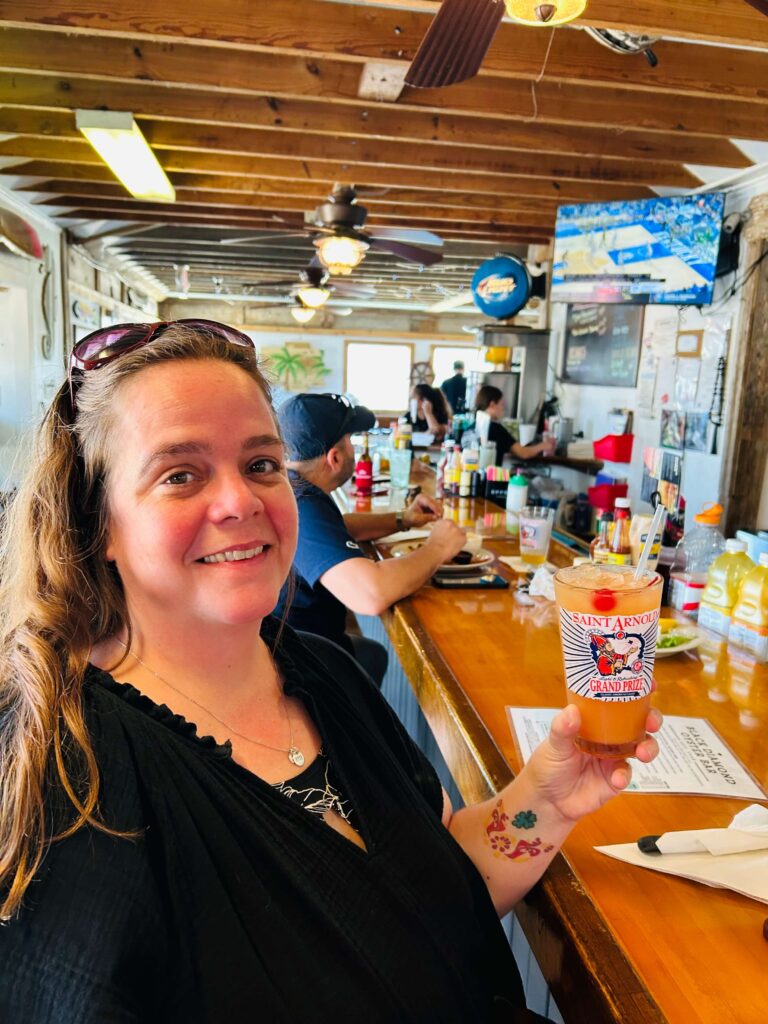 Travel agent, Erin Fisher, enjoys a beer in Corpus Christi, TX 